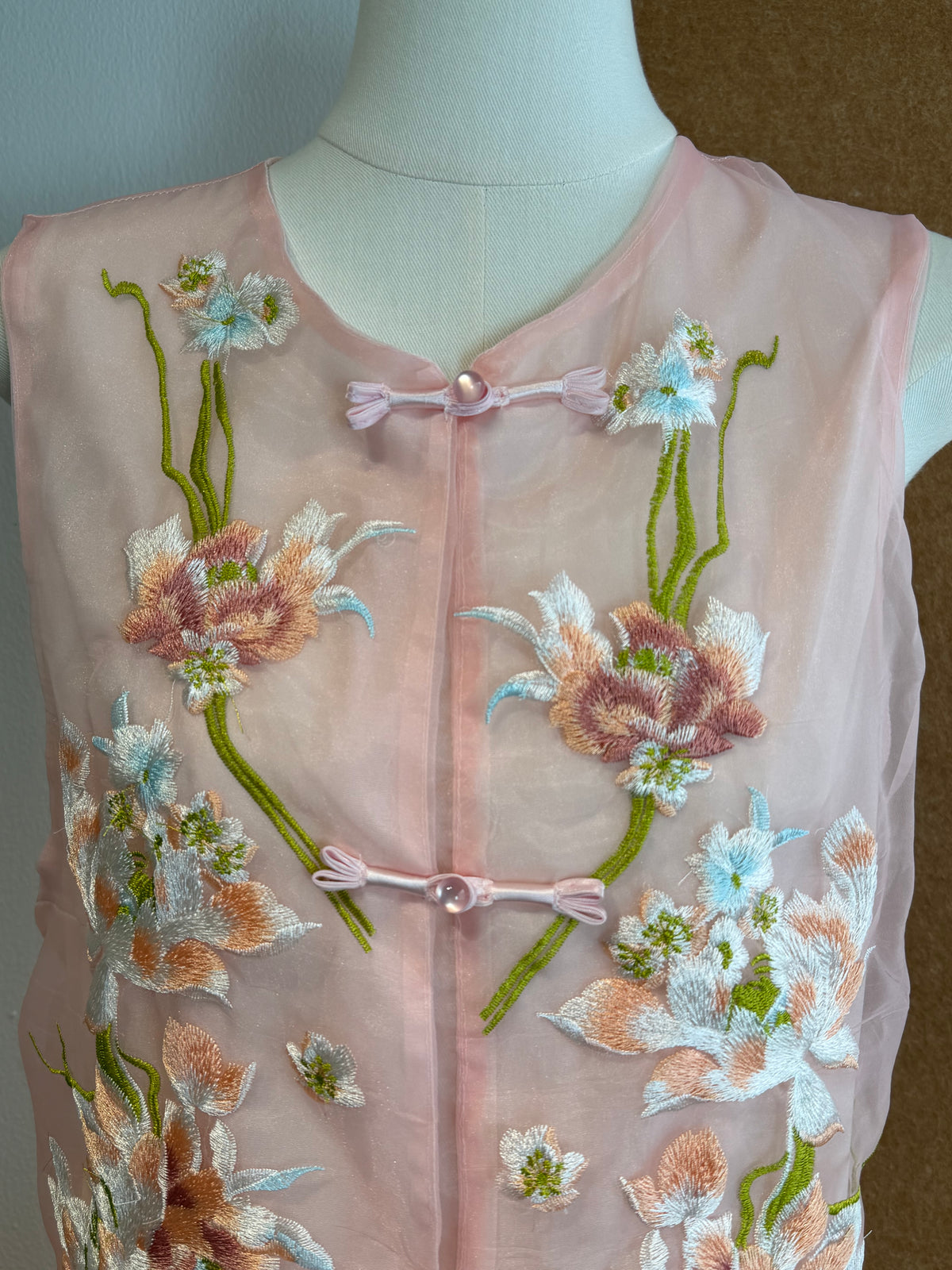 Sleeveless Sheer Organza Top with 3D Raised Floral Embroidery and Satin Loop Buttons | Zoya
