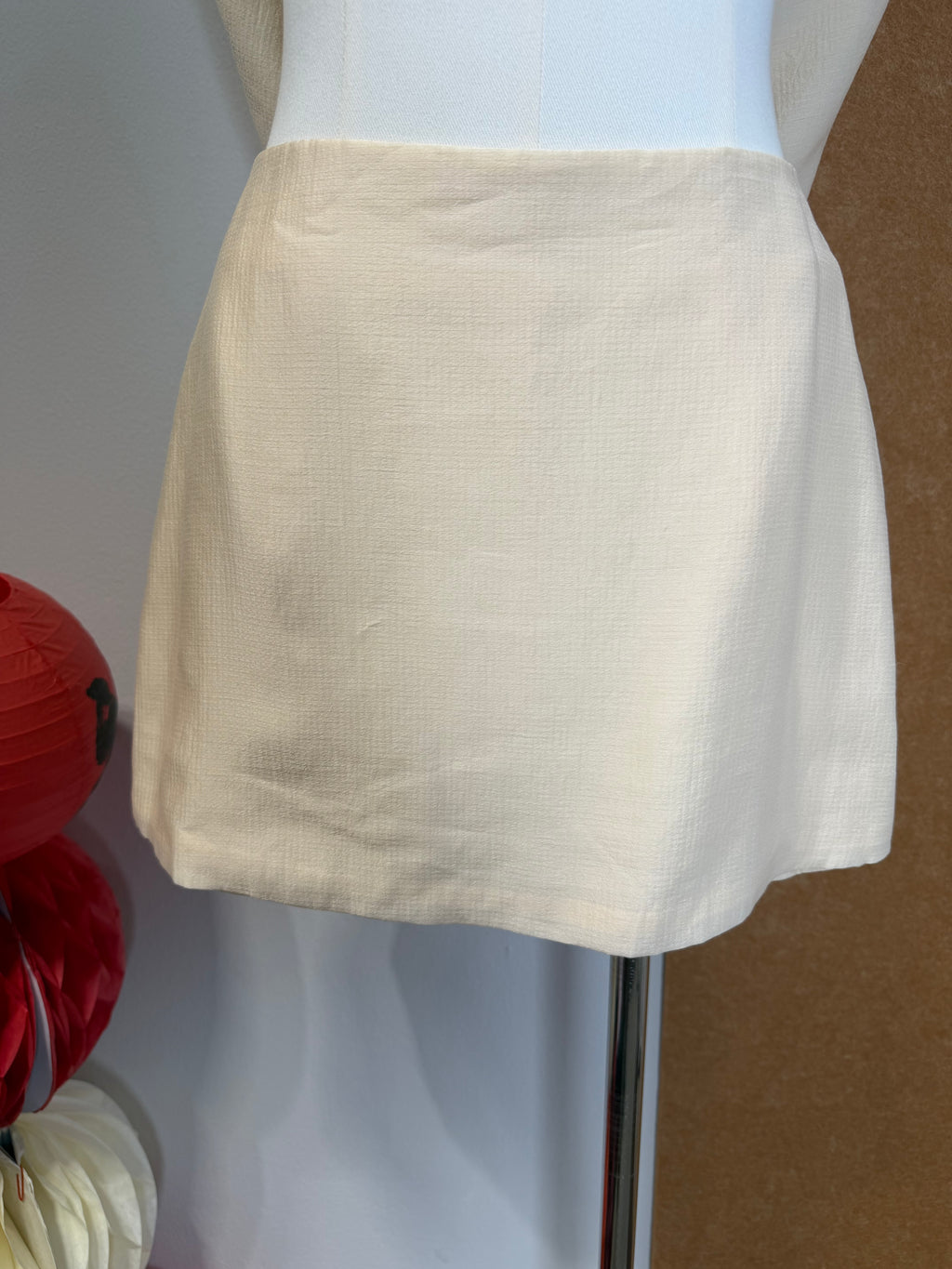 Textured Woven High-Waist Mini Skirt with Hidden Ruffle Hem | Kynah